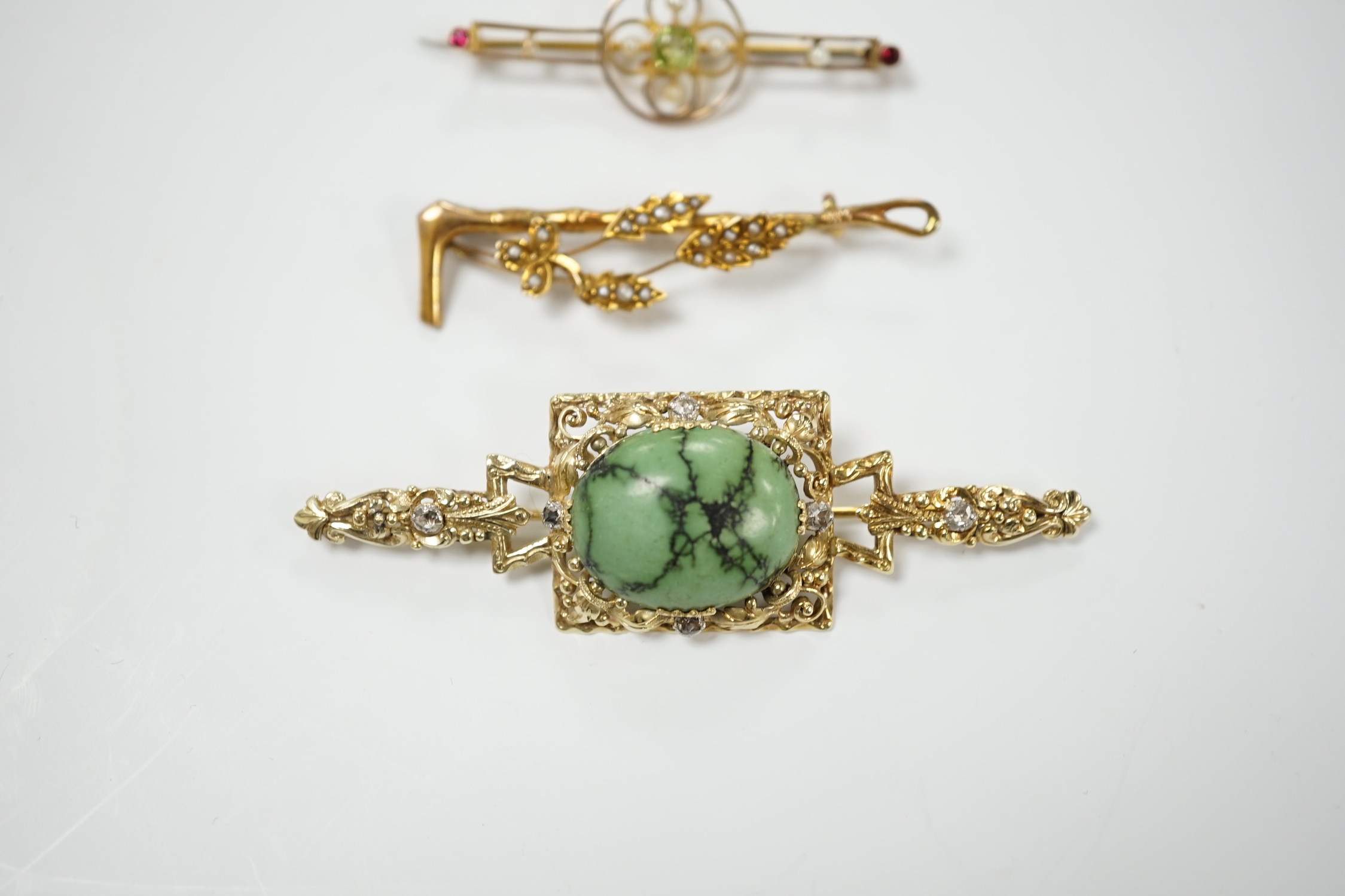 A modern 9ct gold, turquoise and diamond set bar brooch, 69mm and two Edwardian 9ct and gem set bar brooches, including seed pearl set riding crop and spray brooch, gross weight 14.1 grams.